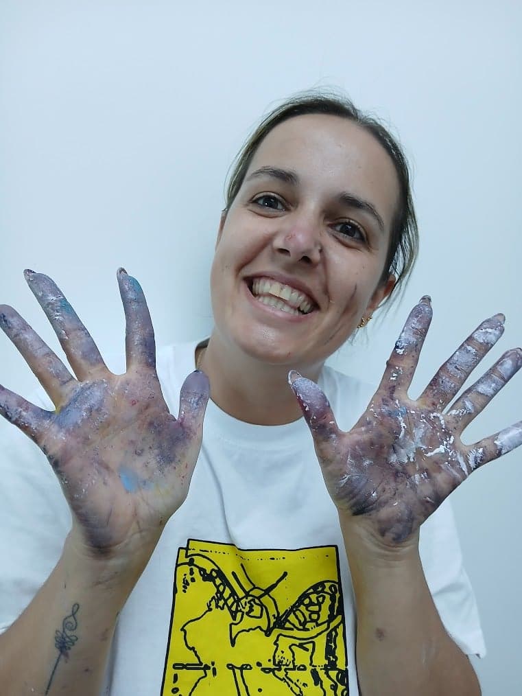 Carina with paint-covered hands